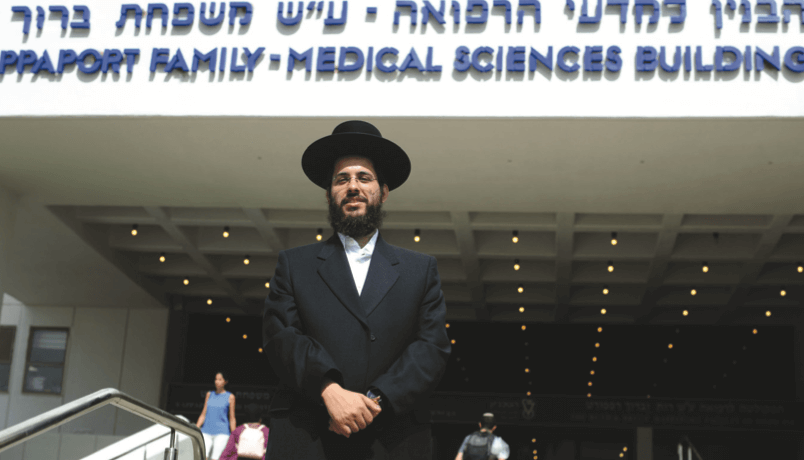 Sabiner poses for a photograph outside the of Rapaport Family Medical Sciences Building (RAMI SHLUSH / TECHNION)