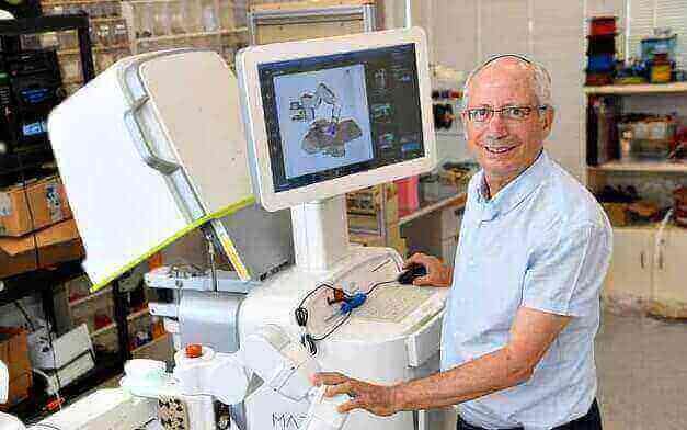 Prof. Moshe Shoham with the Mazor Robotics system, which was sold to Medtronic for $1.64 billion (Courtesy)