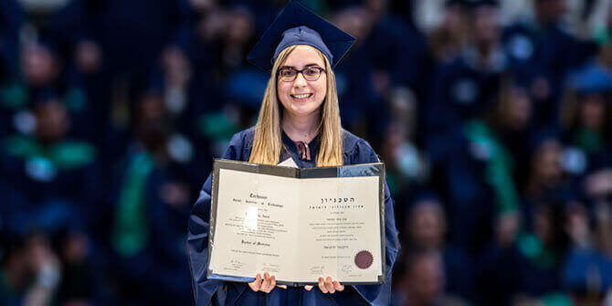 Dr. Amiel receiving her MD diploma