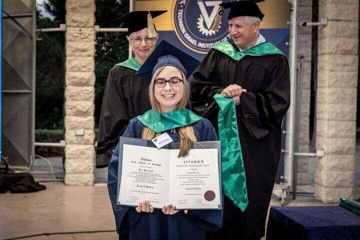 Dr. Amiel receiving her MD diploma